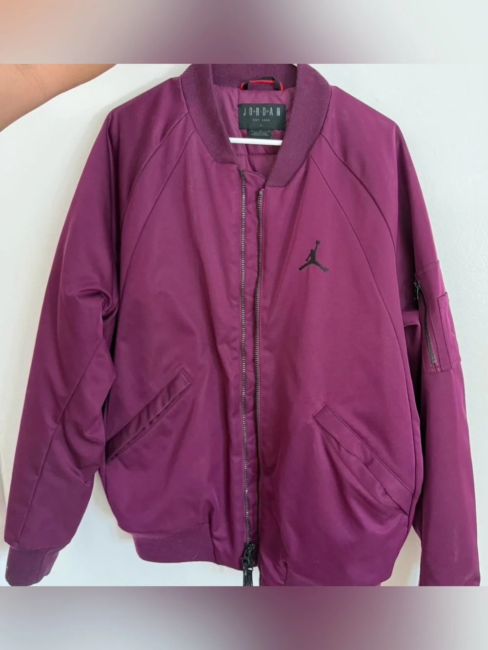 Classic Jordan Sportswear Wings MA-1 jacket features a burgundy wine colorway